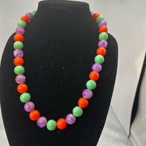 Vintage piece of jewelry, Lucite balls, and beautiful colors. Clip and button​​​